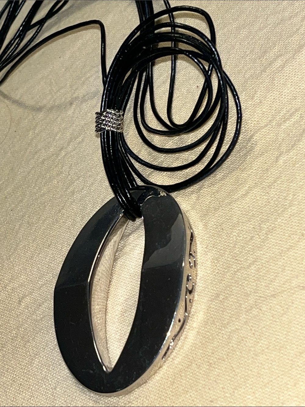 Butler marked Black Multi-Strand Pendant Necklace with Oval Cutout, side design
